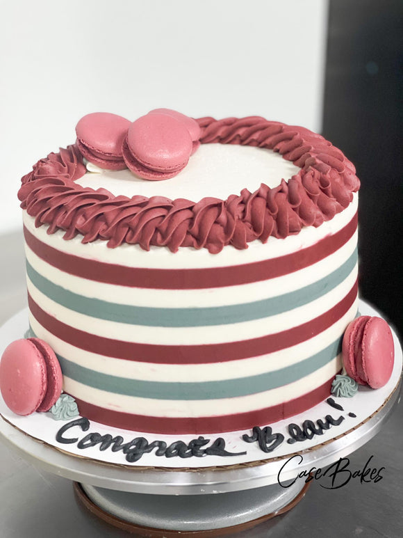 Maroon Striped Cake with Macaroons